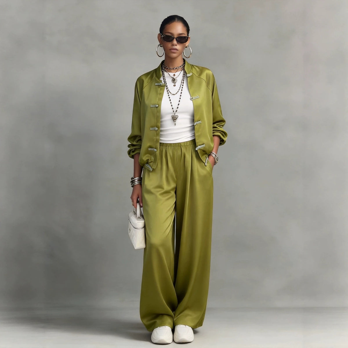 Elegant satin jumpsuit by eprolo featuring hanging wide-leg pants and a drawstring two-piece set.