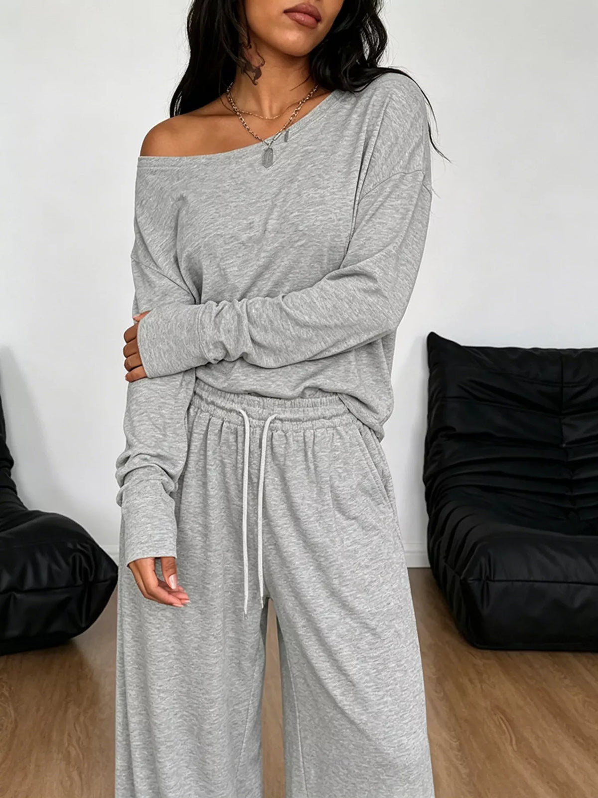Plus size one-shoulder top and drawstring pants set by Trendsi, stylish matching set with a modern, comfortable fit.