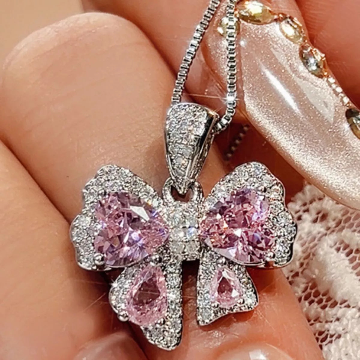 Plush Fashion Hub zircon bow pendant necklace featuring a sparkling zircon bow charm on a delicate chain.