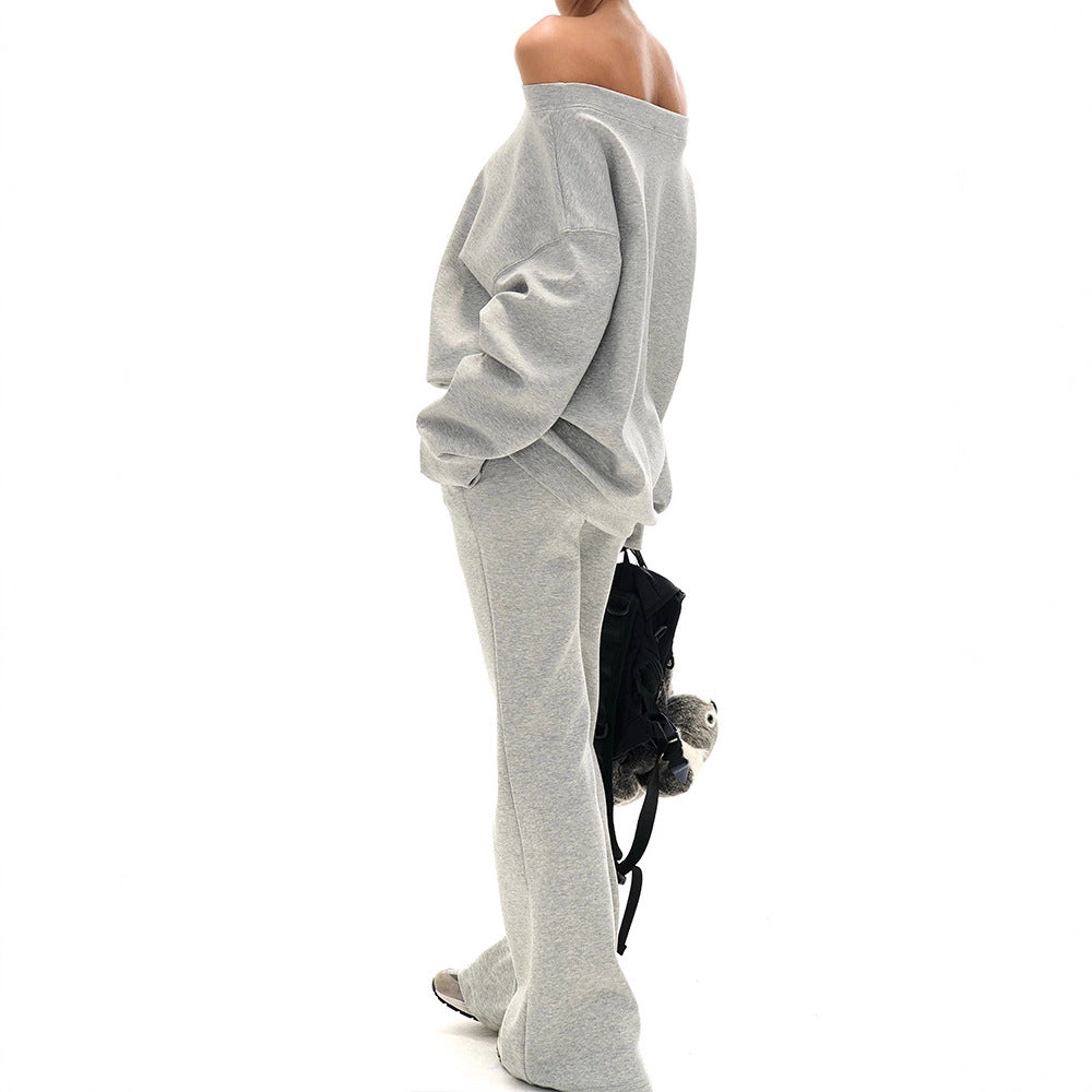 Plush Fashion Hub shoulder cut-out crop top with flared sweatpants outfit set, featuring trendy design and comfortable fabric.