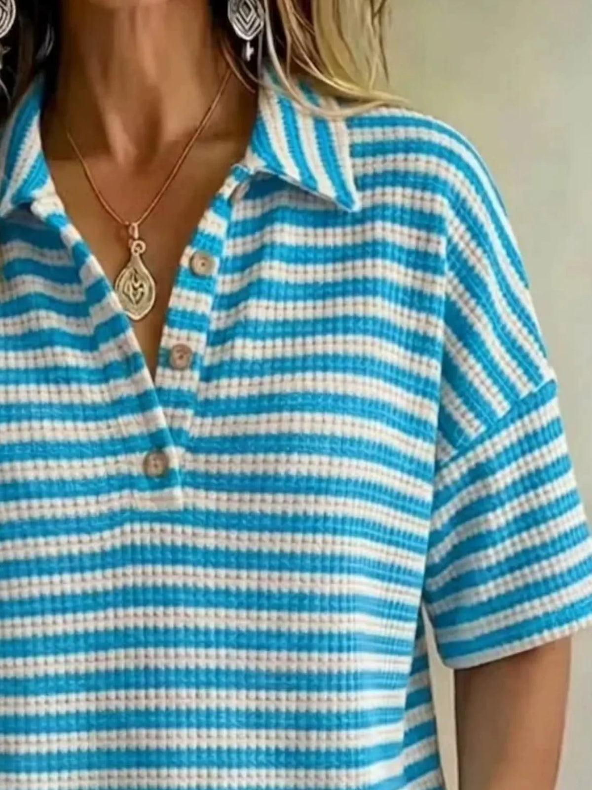 Plus size contrast striped knit polo shirt from Trendsi, full-coverage tops featuring bold stripe pattern and comfortable fit.