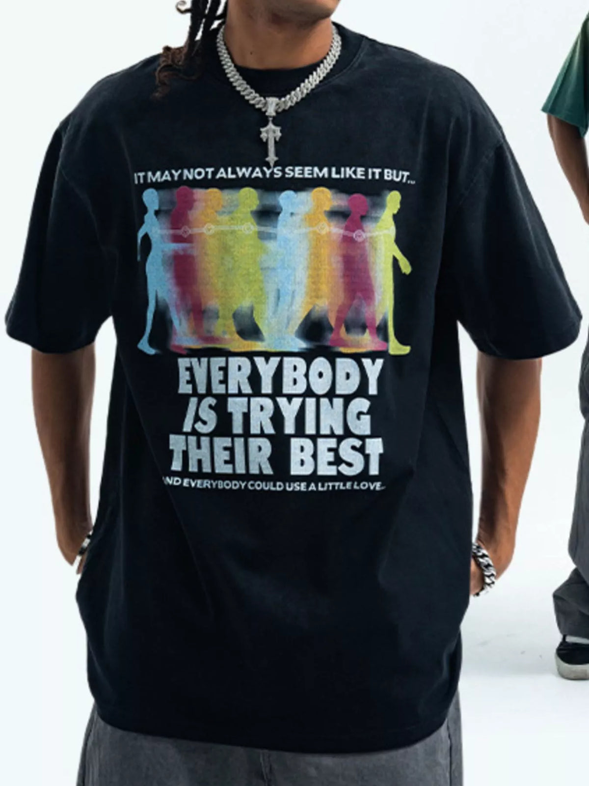Men's graphic round neck short sleeve T-shirt from Trendsi, featuring a bold printed design on soft fabric.