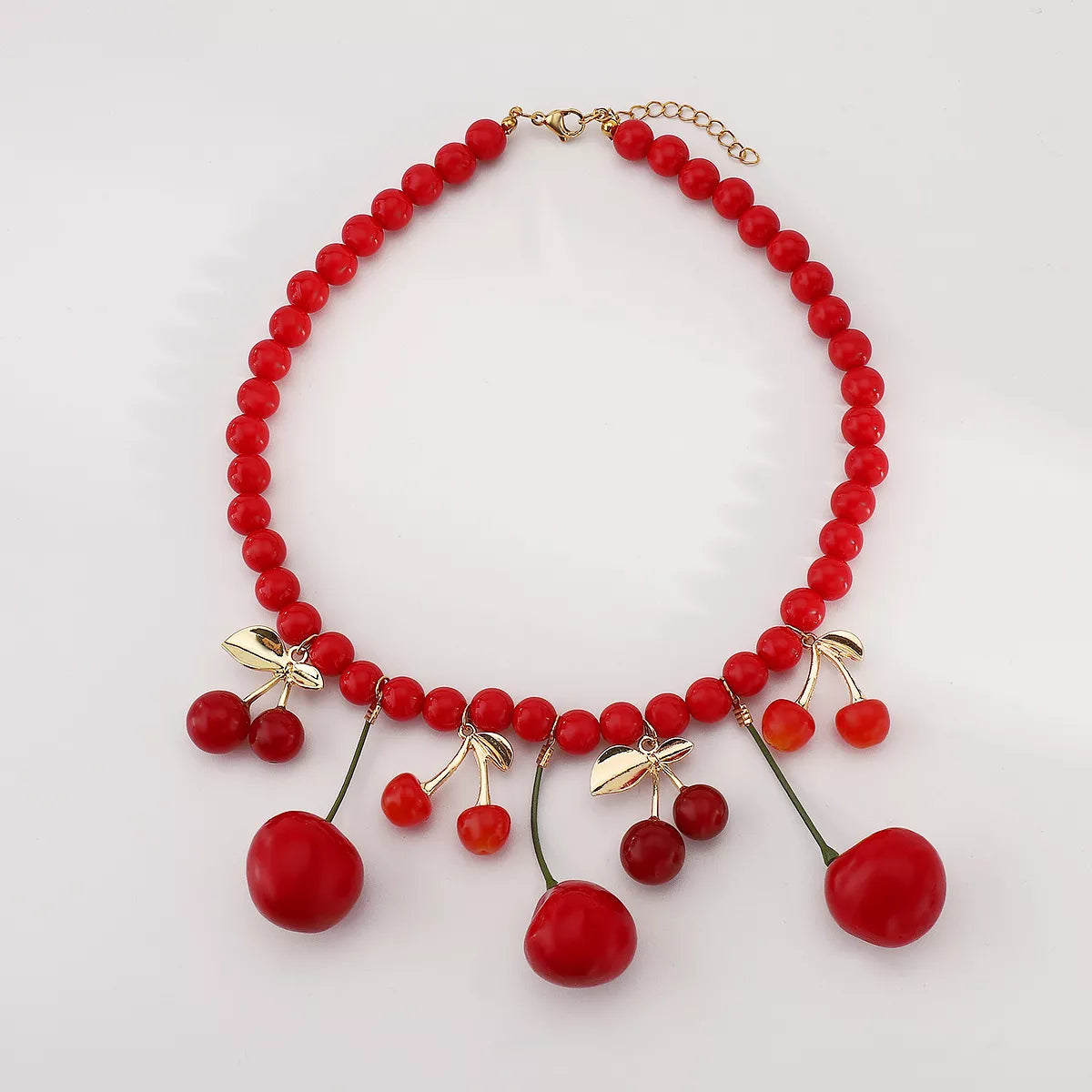 Cherry charm beaded statement necklace by Plush Fashion Hub featuring colorful beads and a cherry pendant.