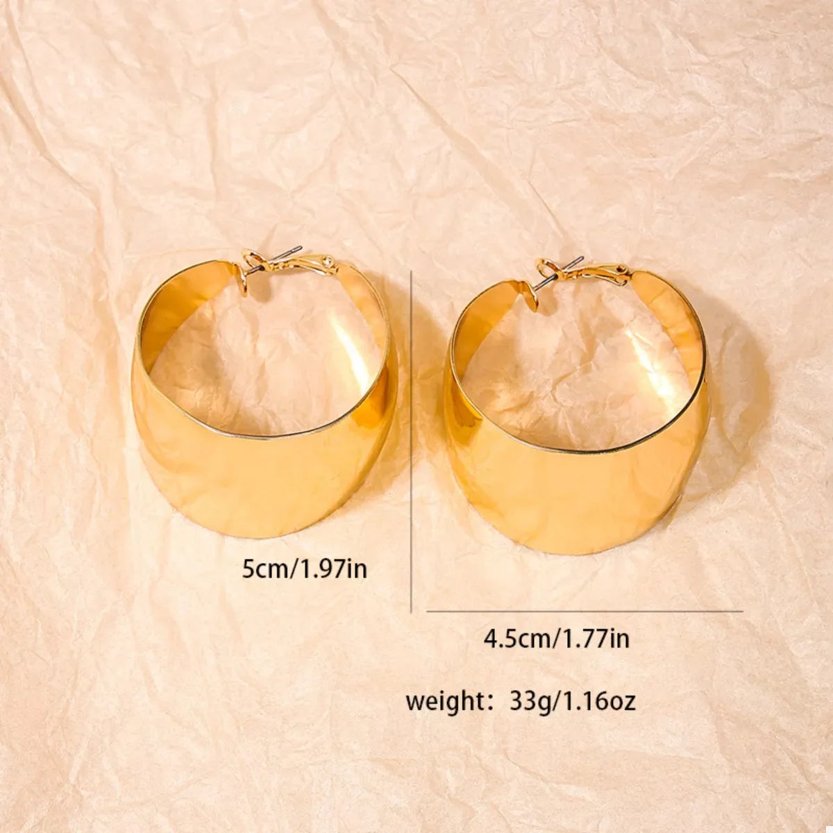 Plush Fashion Hub alloy wide hoop earrings with a shiny gold finish, stylish and bold jewelry accessory for women.