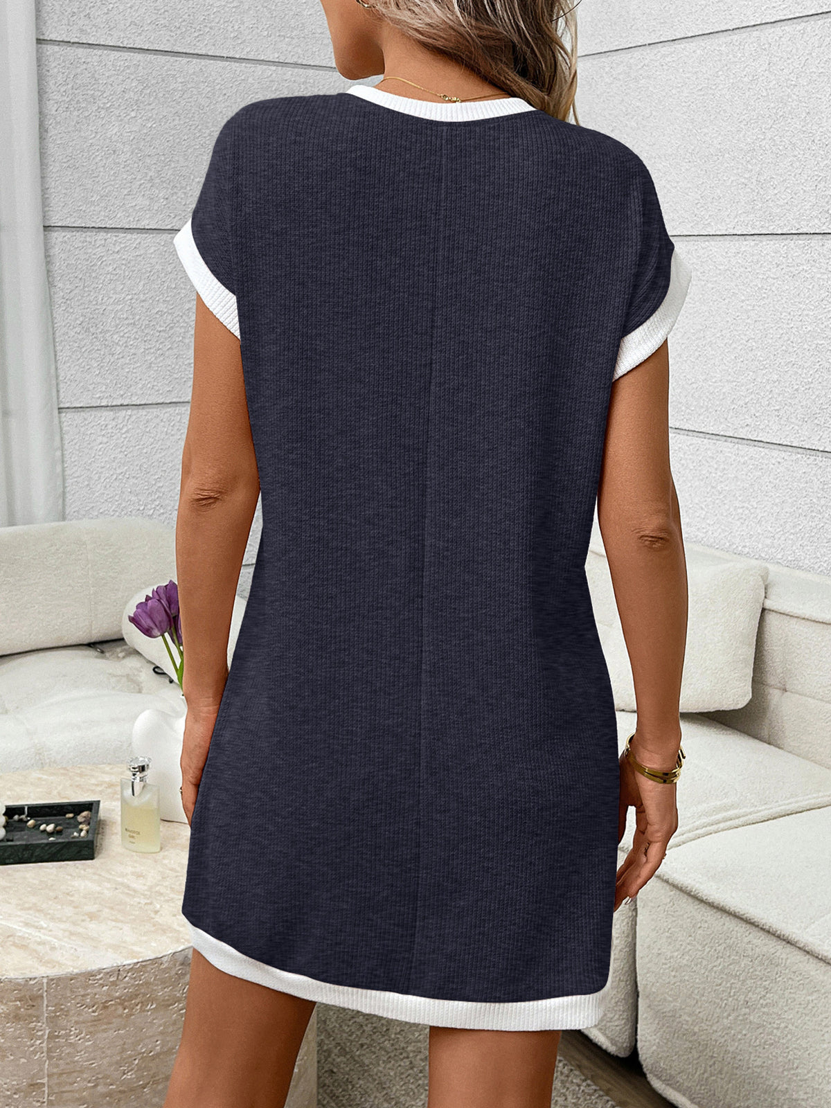 Ribbed knit mini dress with contrast trim and functional pocket by Plush Fashion Hub, shown on a model.