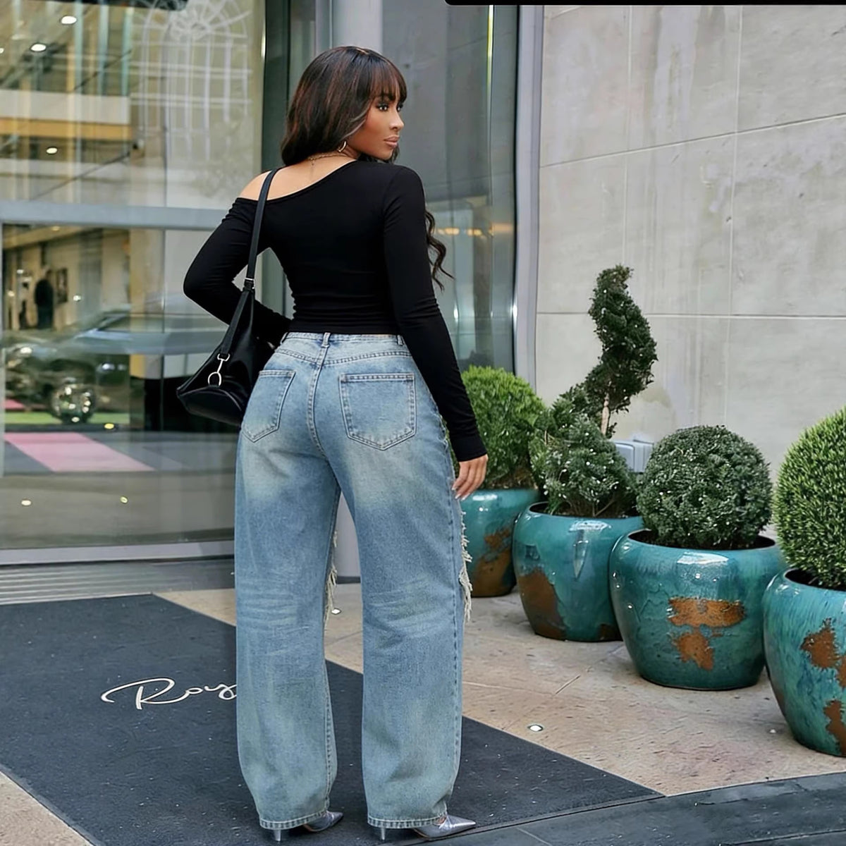 Layered patchwork ripped washed straight-leg denim jeans by Plush Fashion Hub, showing distressed details and casual fit.
