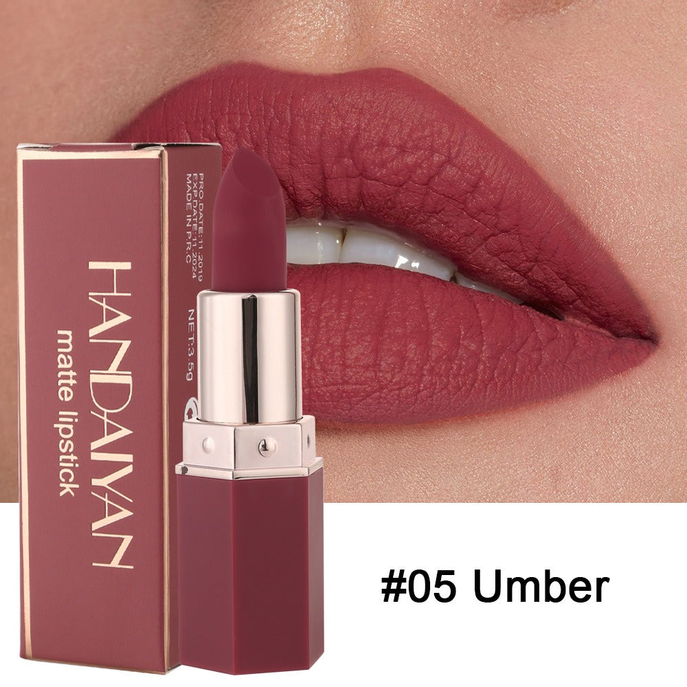 Handaiyan matte lipstick #05 Umber in a rose-colored, octagonal case beside matching packaging and lips.