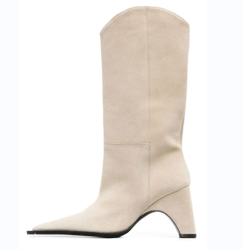 Beige suede knee-high boot with a pointed toe and curved block heel.