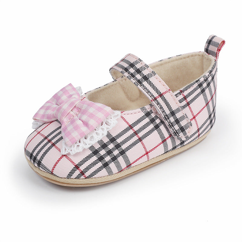 Pink plaid cotton baby Mary Jane shoe with a pink and white gingham bow and white lace trim.