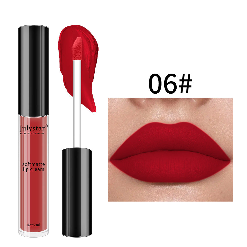 Julystar soft matte lip cream in shade 06, vibrant red with an applicator brush and swatch, on lips.