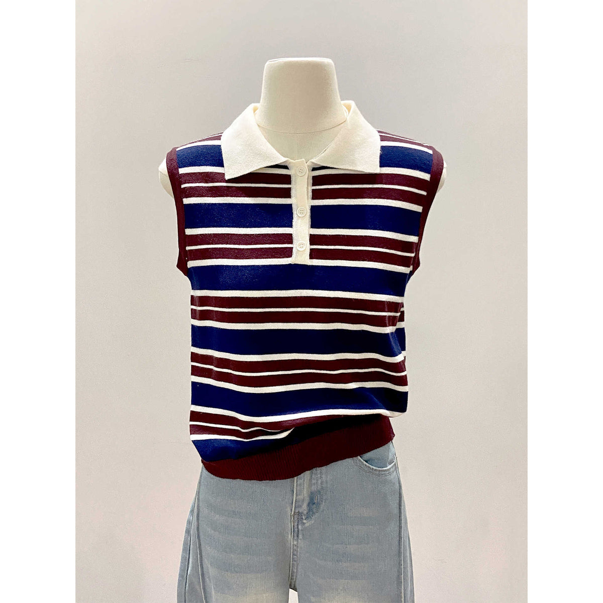 Color-blocked stripe knit vest for women by eprolo featuring vibrant color panels and a sleeveless design.