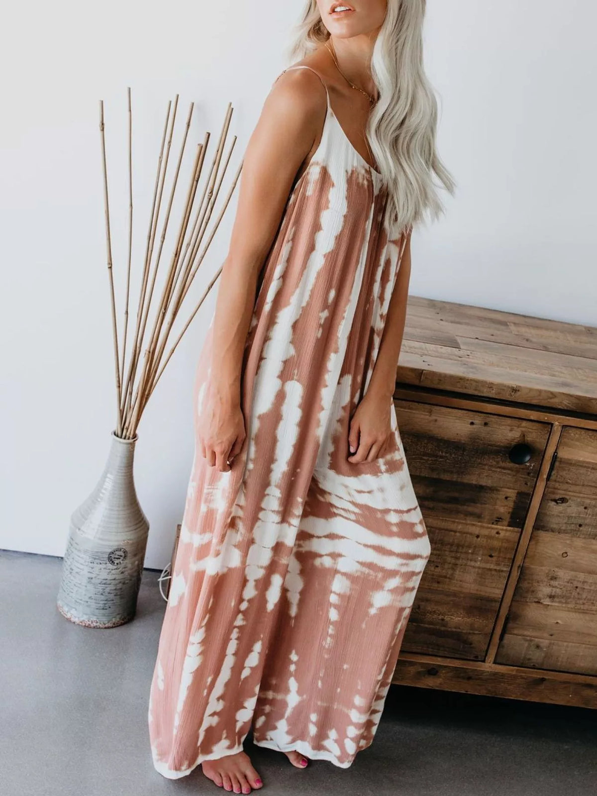 Plus size tie-dye wide leg jumpsuit by Plush Fashion Hub, full-length with vibrant colorful pattern and comfortable fit