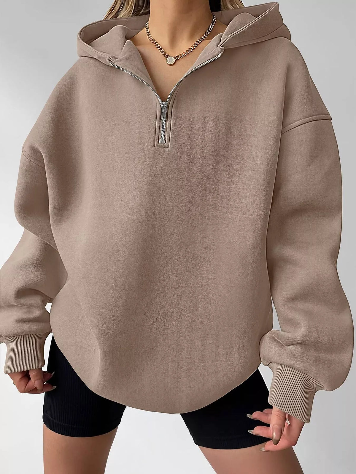 Gray oversized quarter-zip hoodie from Trendsi, casual tops with a relaxed fit and front zipper detail.