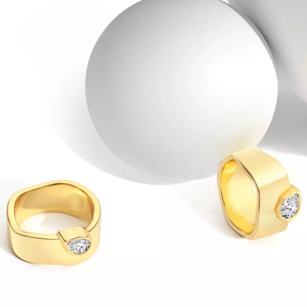18K gold-plated minimalist ring with sleek, simple band design from Plush Fashion Hub showing close-up detail.