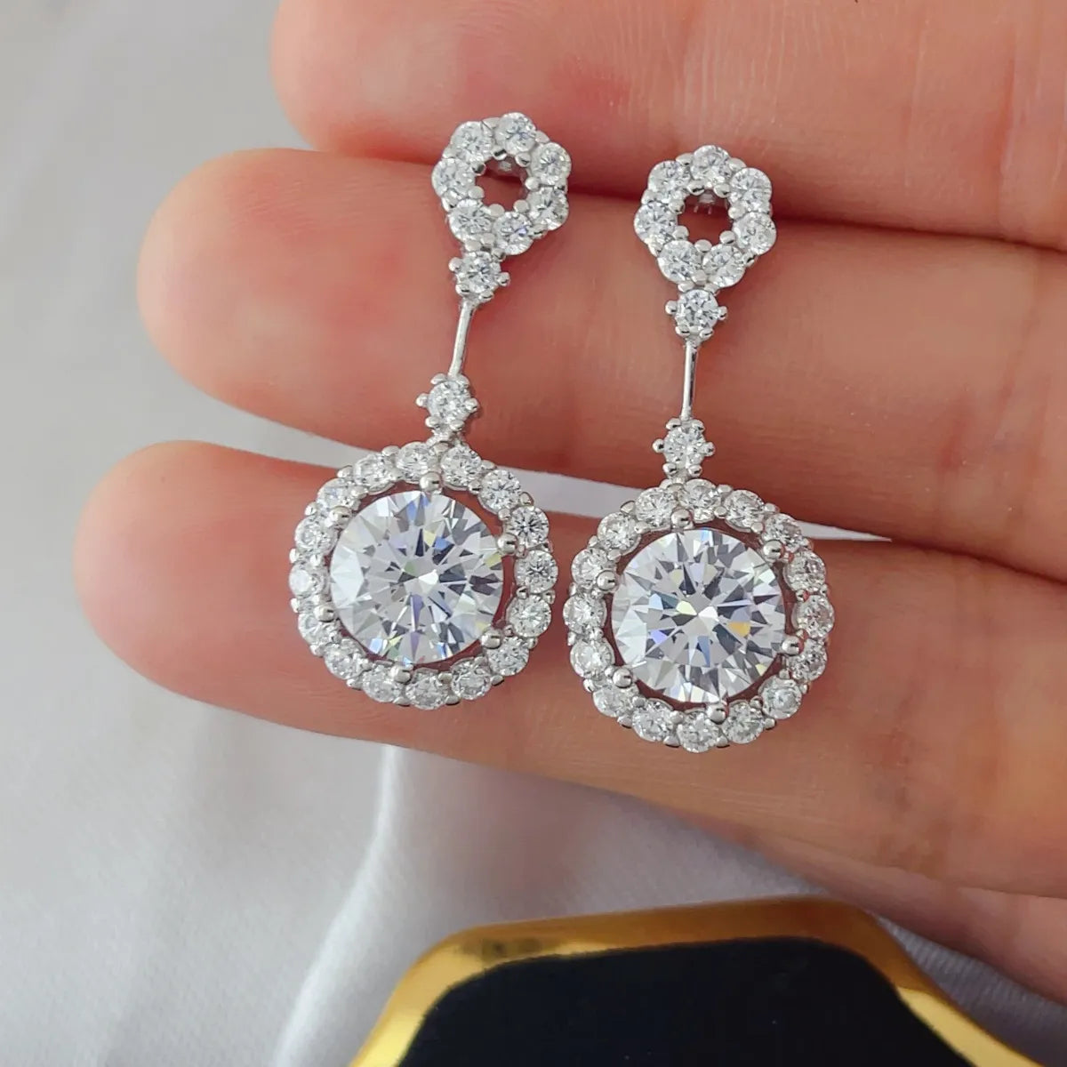 Plush Fashion Hub 4 Carat Crystal Drop Earrings with round halo design and dangling crystal drops, elegant jewelry accessory.