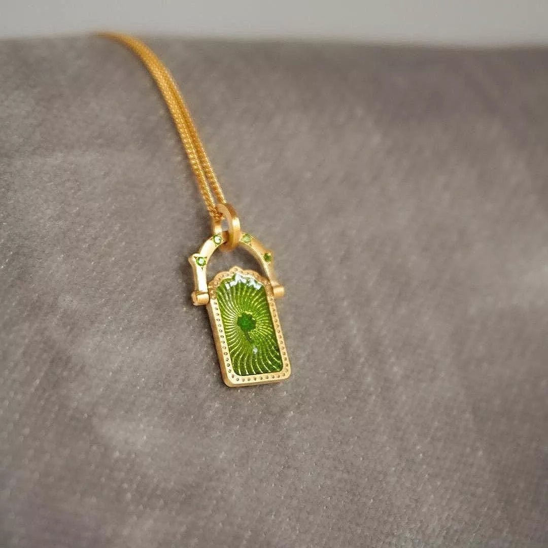 18K gold-plated titanium steel pendant necklace with a sleek, modern design, featuring a polished surface and elegant chain.