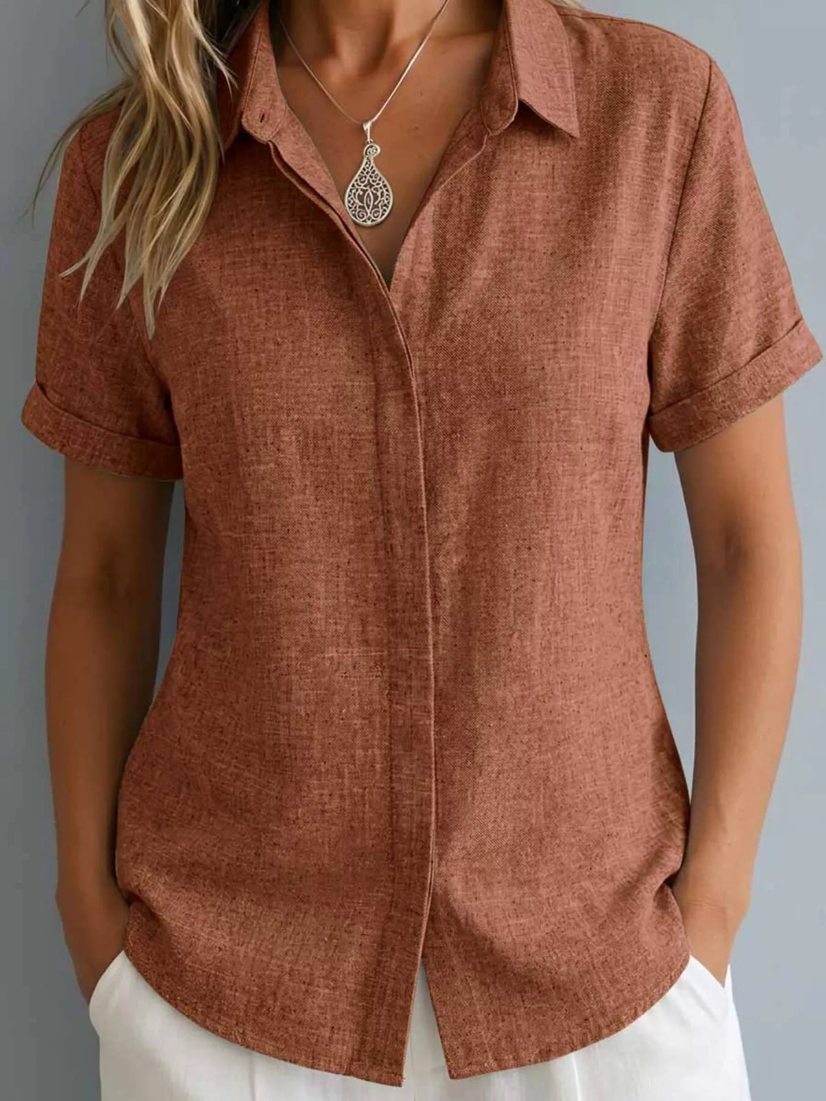 Plus size collared short sleeve shirt from Trendsi, shown in full size, featuring a classic collar and lightweight fabric.
