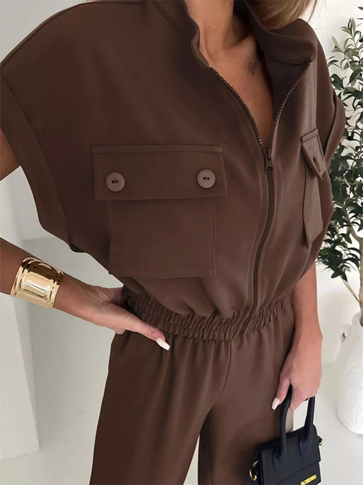 Plush Fashion Hub cargo pocket zipper front jumpsuit featuring a fitted design, front zipper closure, and utilitarian cargo pockets.