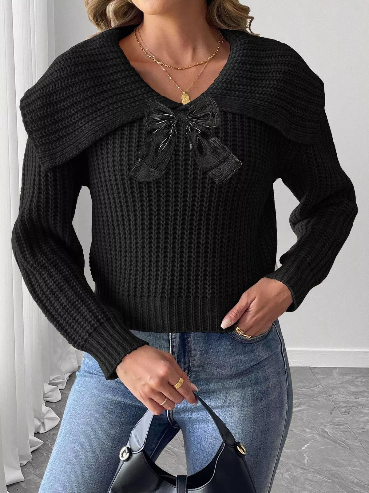 Contrast bow long sleeve sweater paired with a stylish skirt, showcasing trendy fashion by Trendsi.