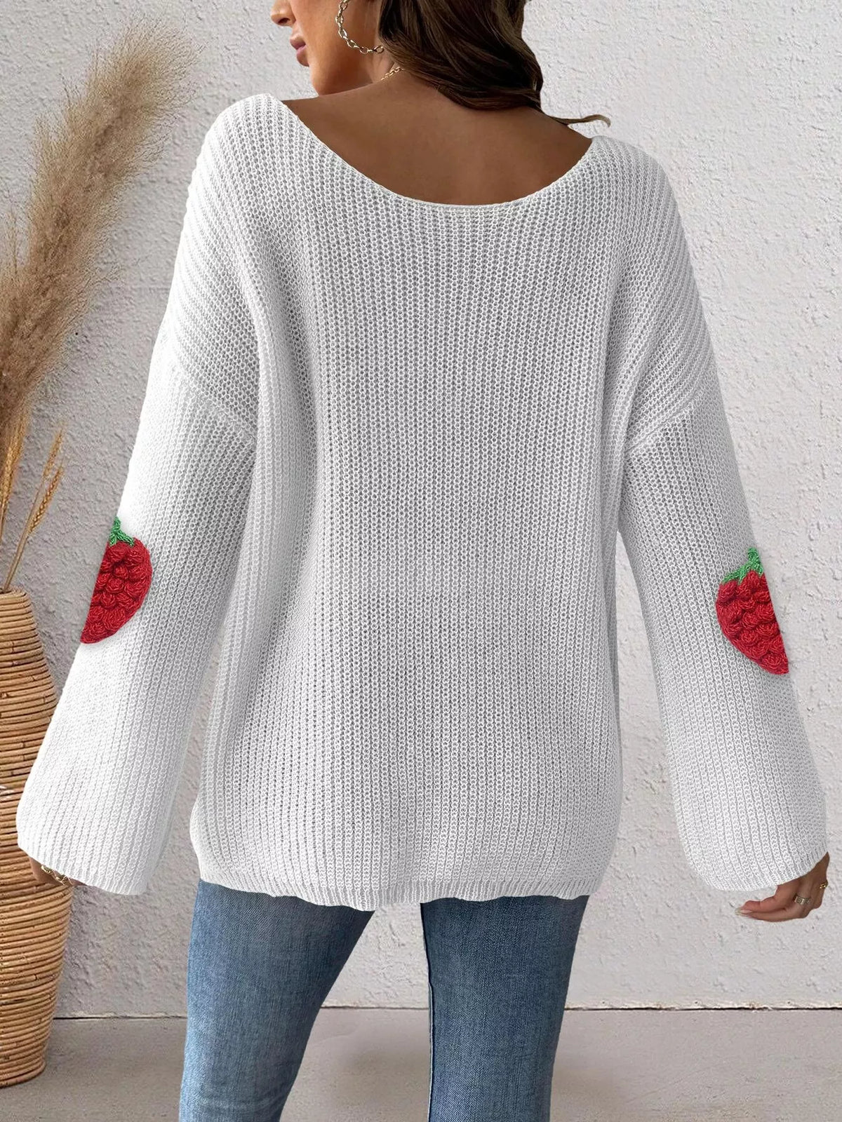Pink oversized sweater with strawberry applique details, trendy and cozy, from Trendsi, perfect for casual wear.