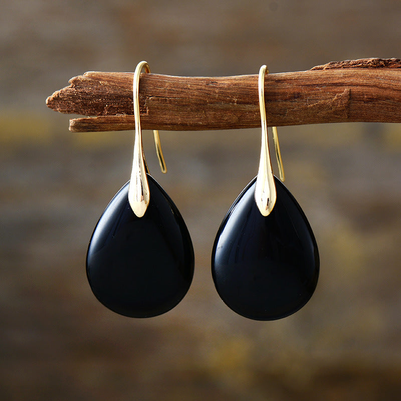 Elegant crystal dangle earrings by Plush Fashion Hub featuring sparkling crystal drops and silver hooks for stylish wear.