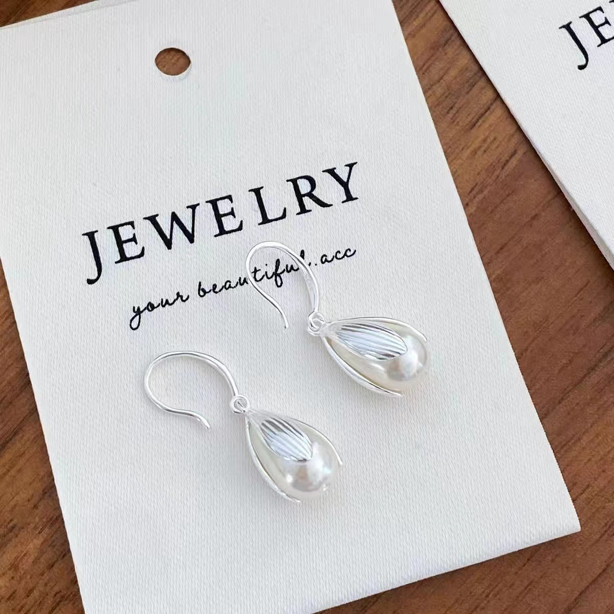 Sterling silver drop earrings from Plush Fashion Hub featuring elegant teardrop design and polished finish.