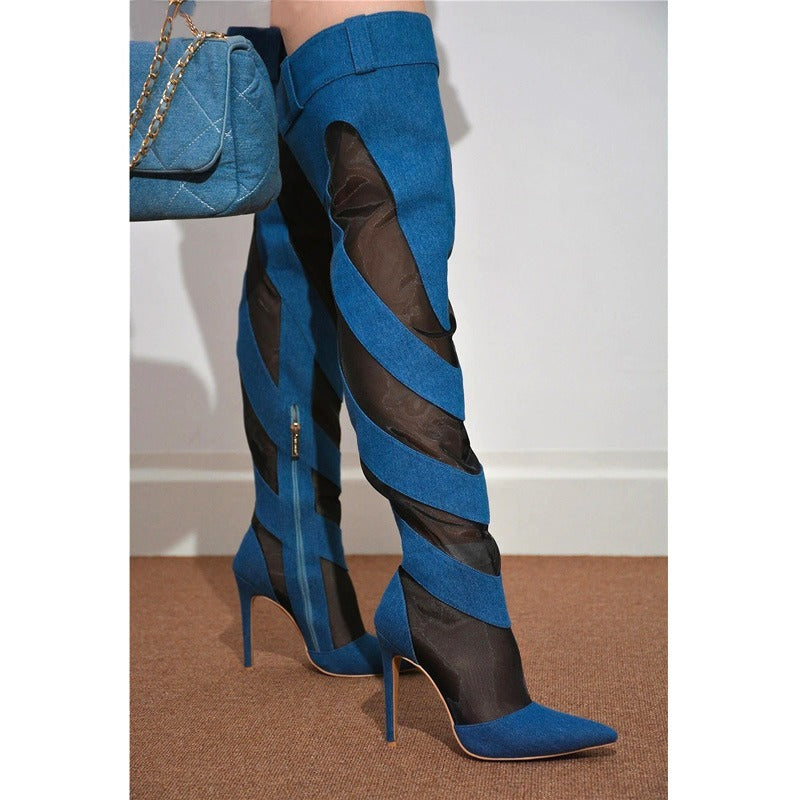 Blue denim over-the-knee boots with mesh panels, stiletto heels, pointed toes, and diagonal striped cutouts.