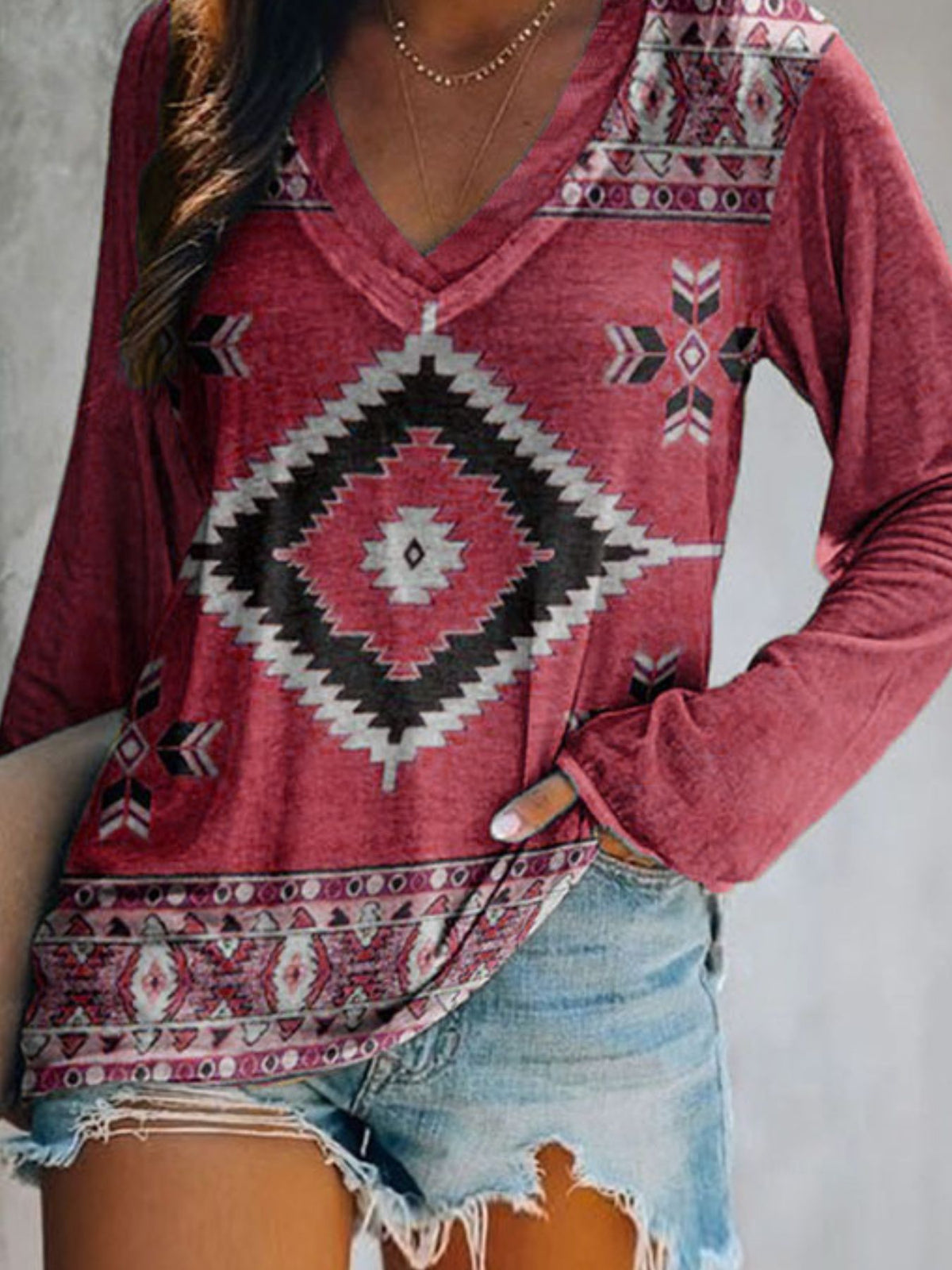 Plus size V-neck long sleeve T-shirt with geometric print from Plush Fashion Hub, casual style, featuring a modern pattern.