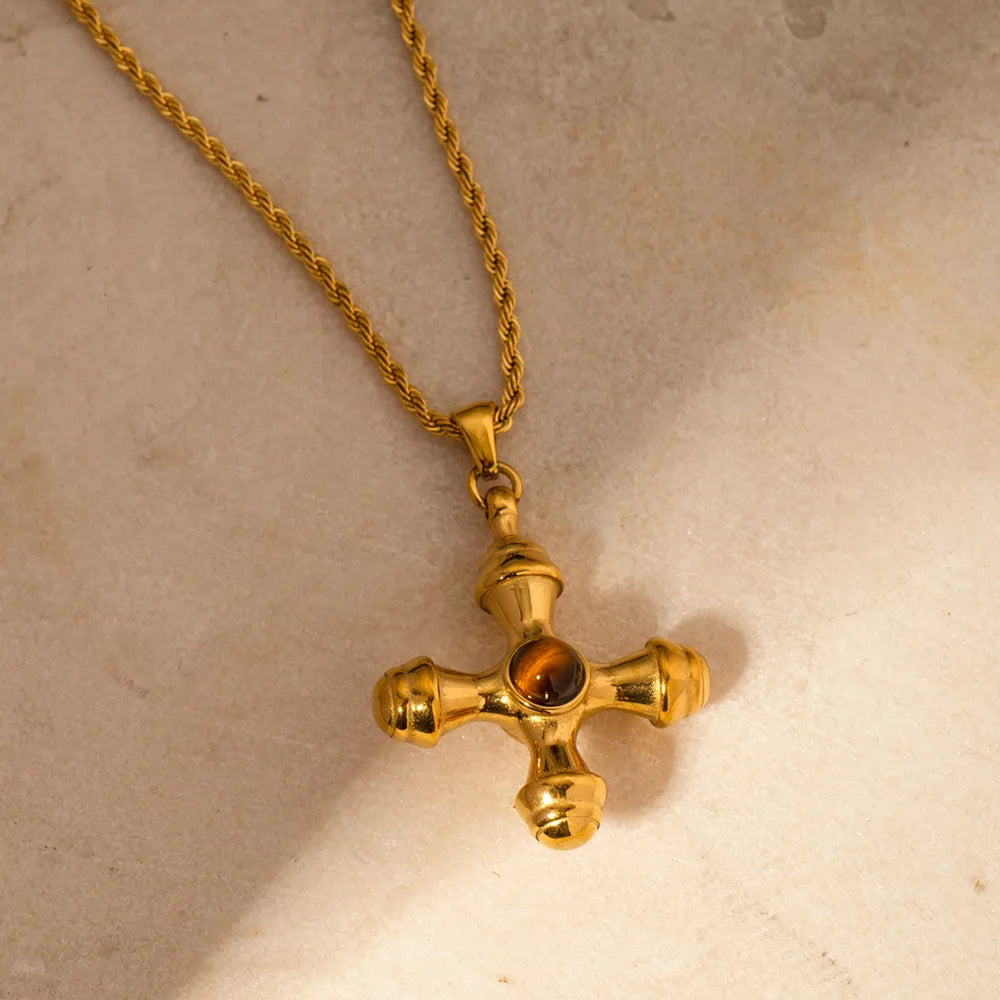 Gold-plated stainless steel cross pendant necklace with a sleek design, perfect for everyday wear or special occasions.