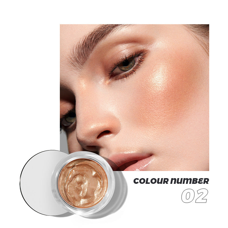 Shimmery bronze cream highlighter in a glass jar, shown worn on a model's cheekbone, labeled colour number 02.