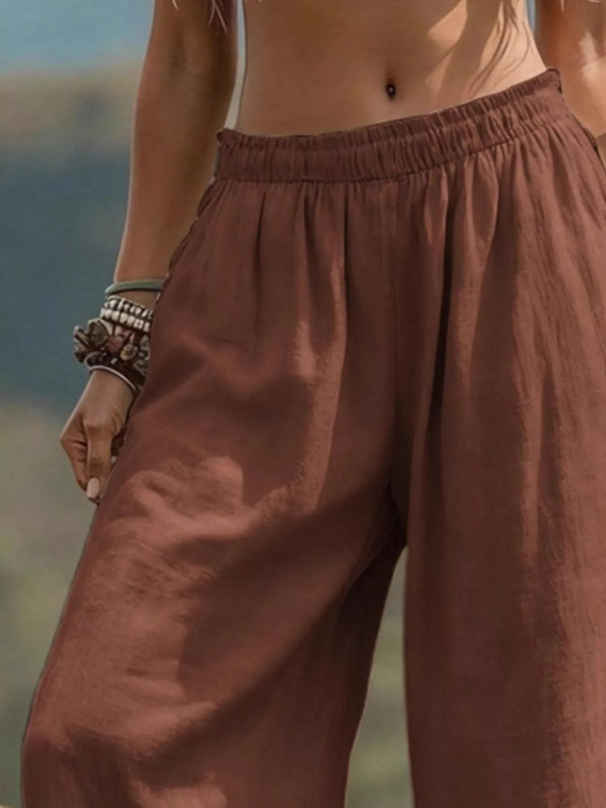 Bohemian wide-leg pants in full size and plus size, featuring flowy fabric and relaxed fit, styled with a casual top.