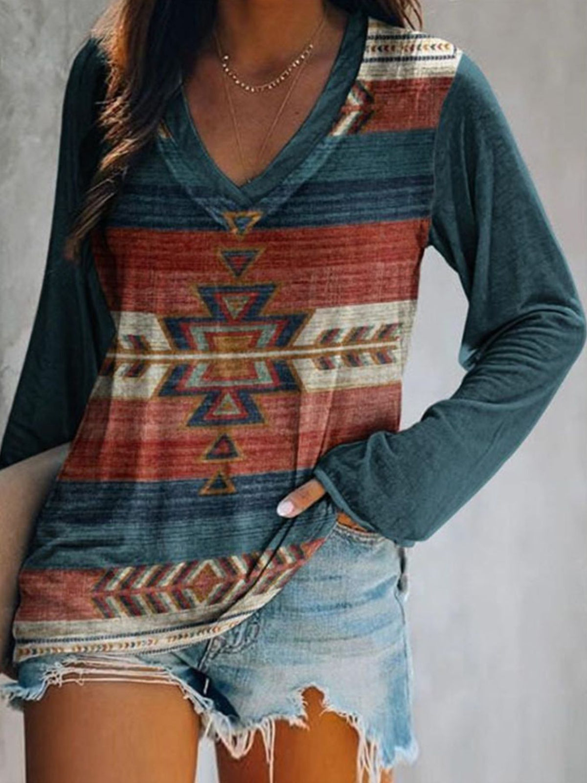 Plus size V-neck long sleeve T-shirt with geometric print from Plush Fashion Hub, casual top with modern design.