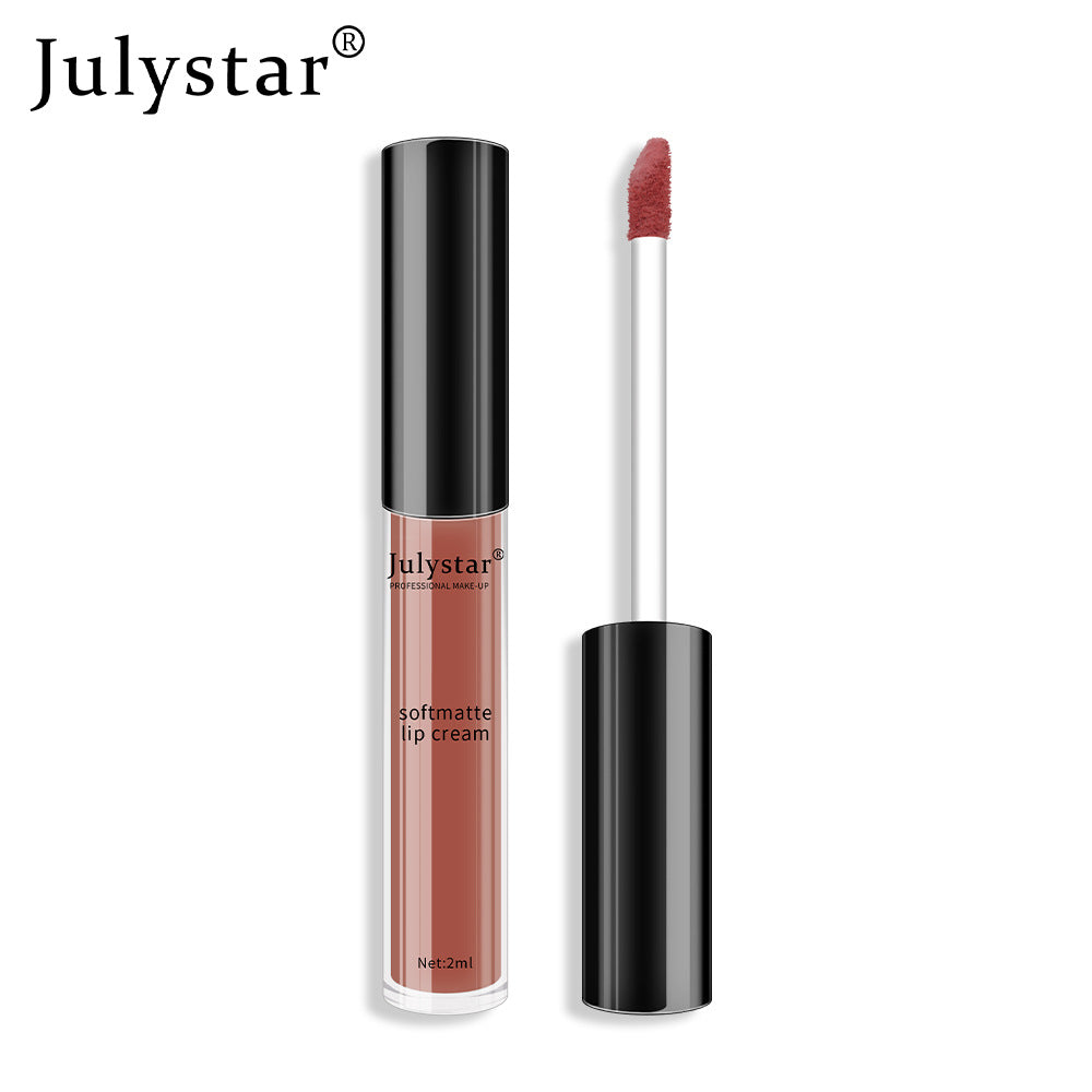 Julystar soft matte lip cream in mauve-brown, with black cap and doe-foot applicator showing product.