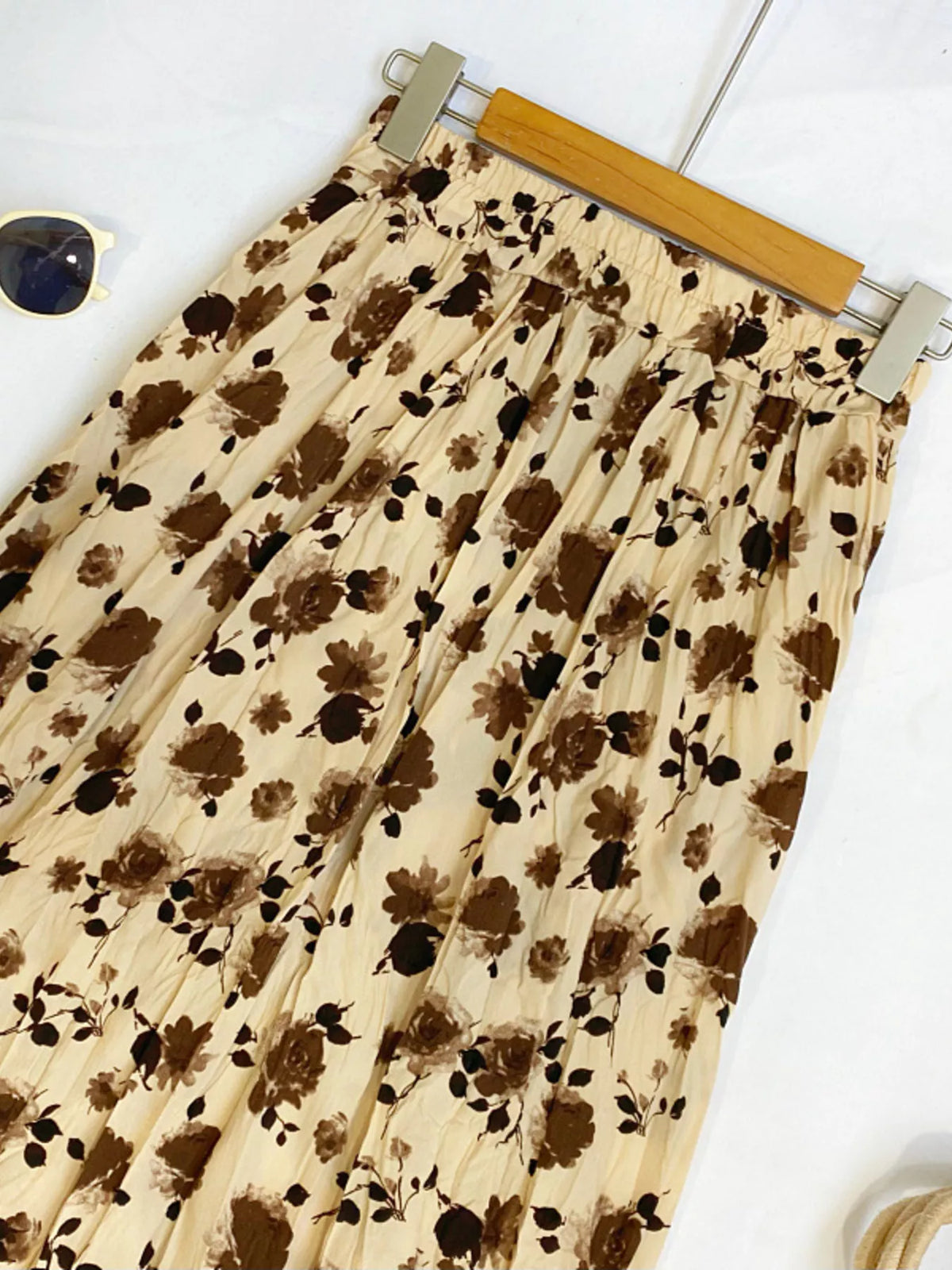 Floral print elastic waist midi skirt by Plush Fashion Hub, featuring a flowy design and vibrant floral pattern.