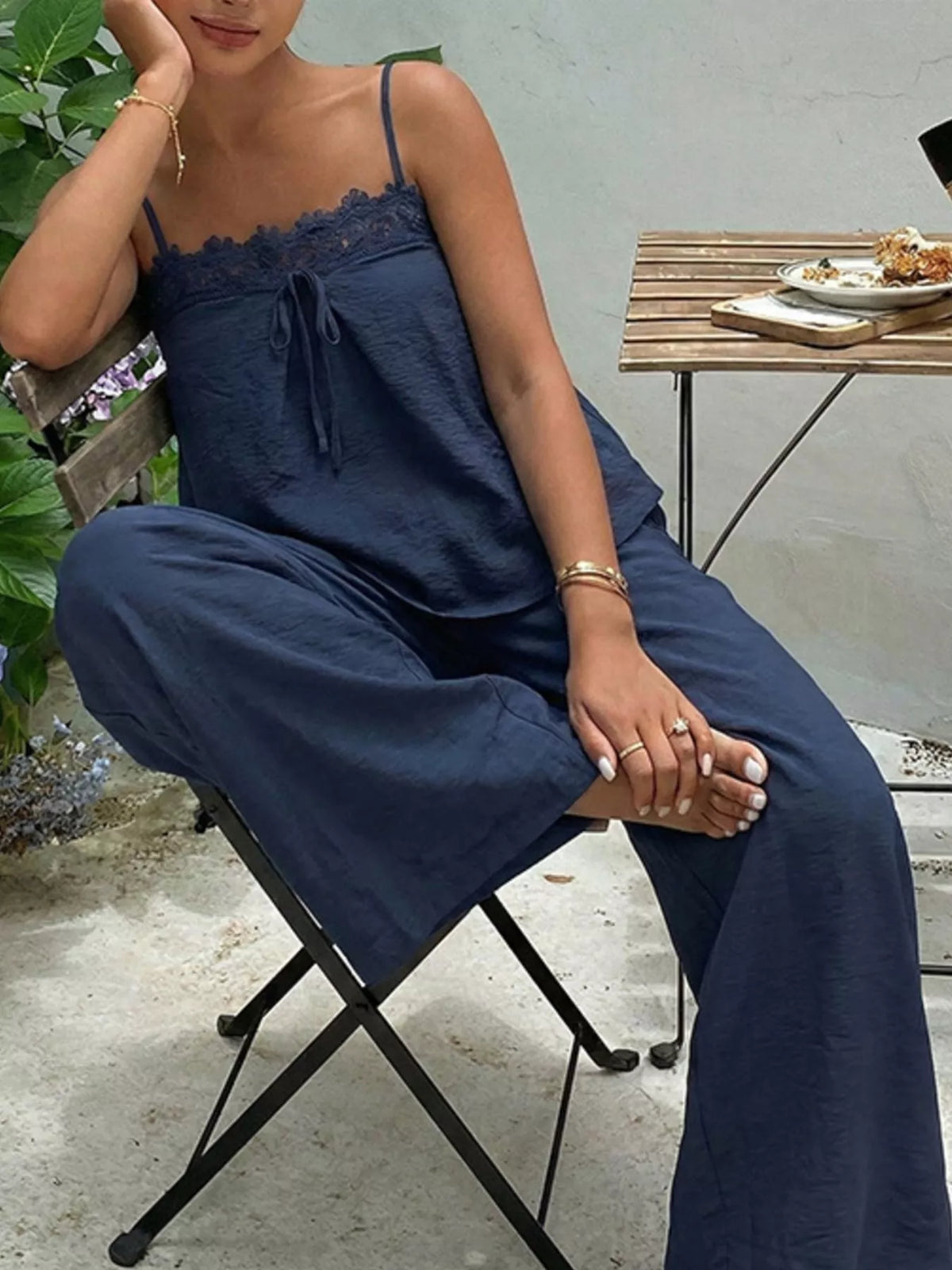Lace trim cami and wide-leg pants set by Plush Fashion Hub, featuring a stylish matching clothing ensemble with delicate lace details.