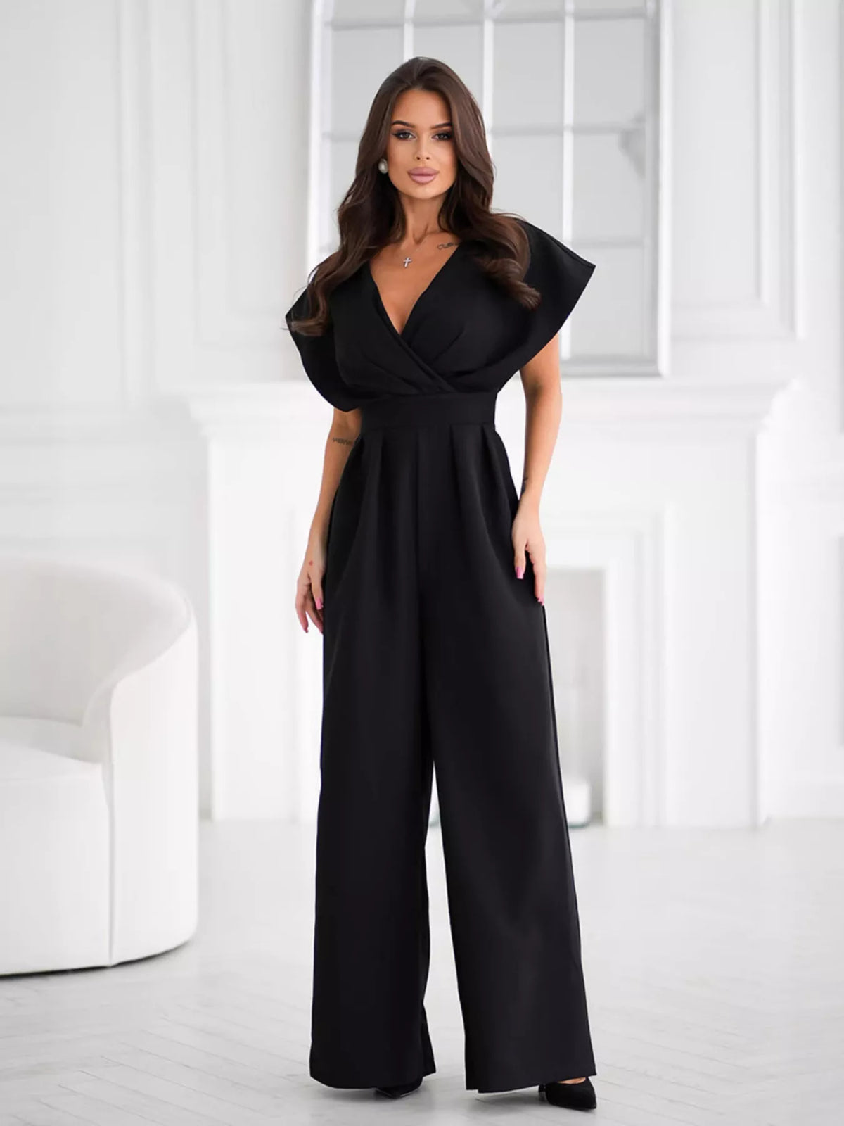 Plush Fashion Hub surplice wide-leg jumpsuit in soft fabric, featuring a fitted waist and flowing pant legs, perfect for stylish comfort.