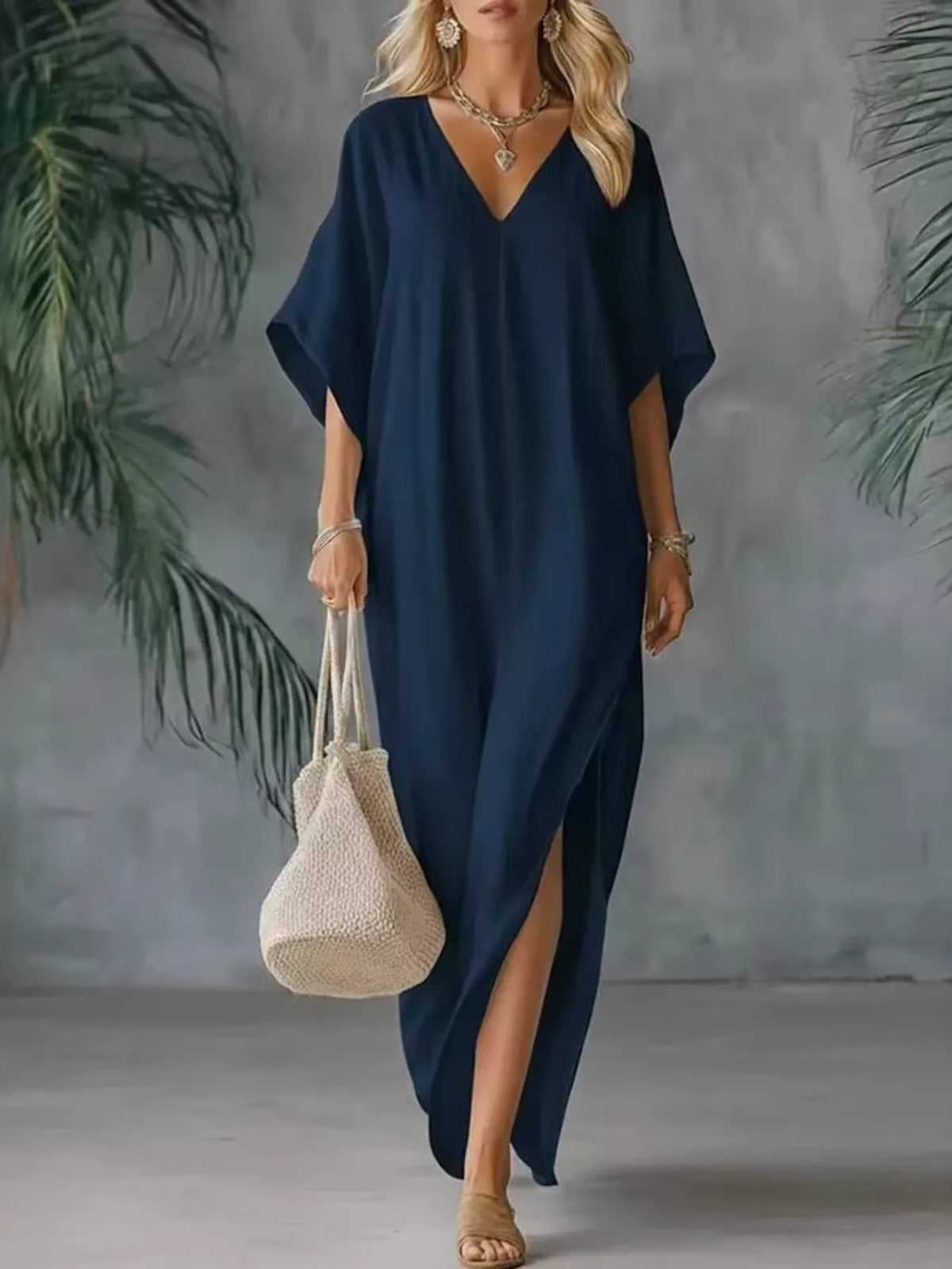 Plush Fashion Hub plus size v-neck maxi dress with side slits, flowing fabric, and full length, perfect for elegant casual wear.