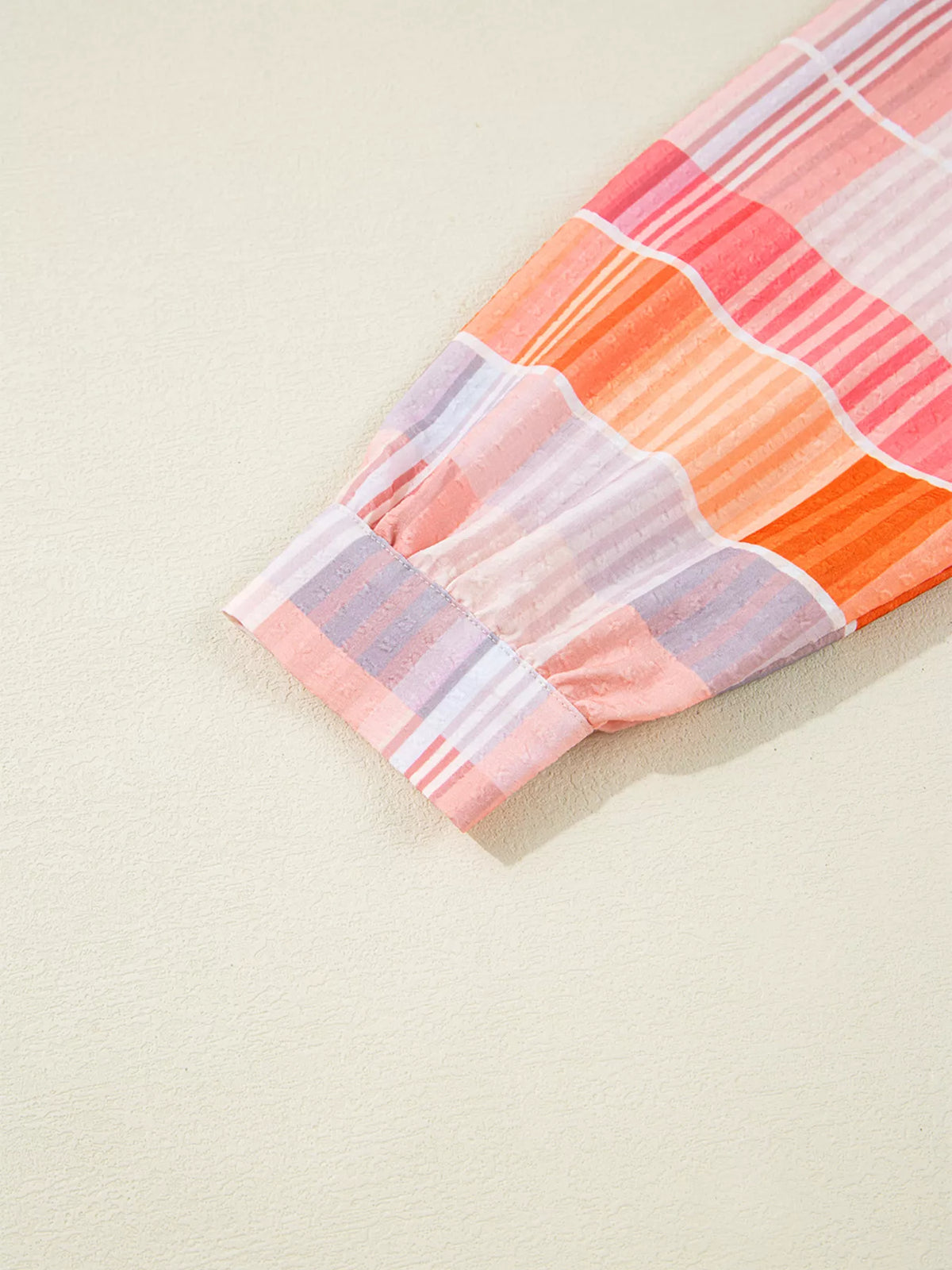 Oversized check tunic shirt for women featuring a relaxed fit, button front, and classic plaid pattern.
