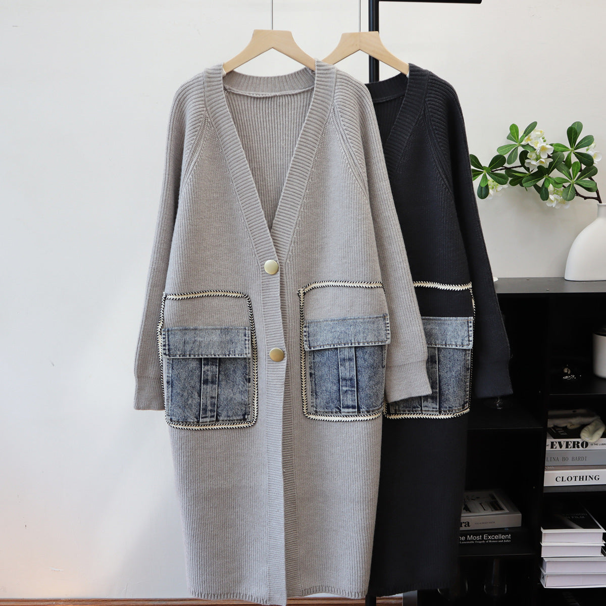 Grey ribbed knit cardigan with V-neck, two buttons, and large denim patch pockets.