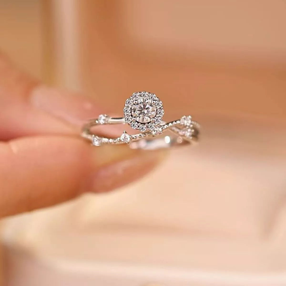 Sterling silver layered ring with a 1-carat moissanite gemstone, featuring intricate design details.