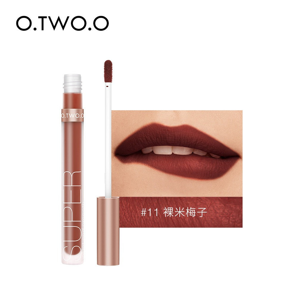 O.TWO.O matte liquid lipstick in shade #11, featuring dark plum-red color, applicator, and swatch on lips.