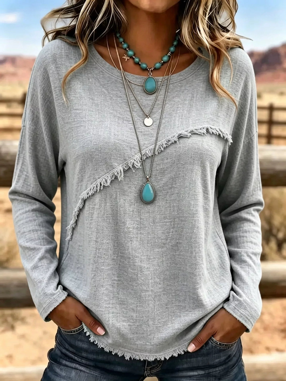 Plus size long sleeve T-shirt with fringe details, casual trendy top by Trendsi, shown in a comfortable fit with fringe accents.