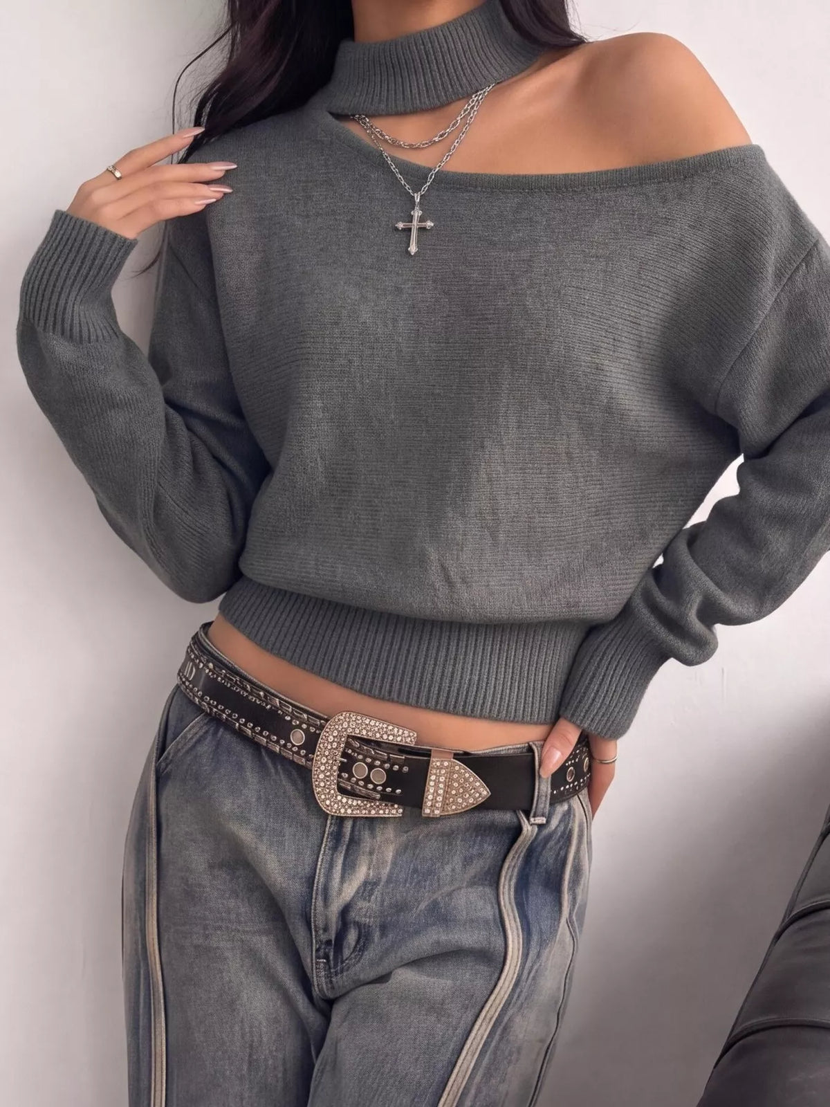 Cold-shoulder dropped shoulder sweater by Trendsi featuring a cozy knit fabric and stylish cut-out shoulder design.
