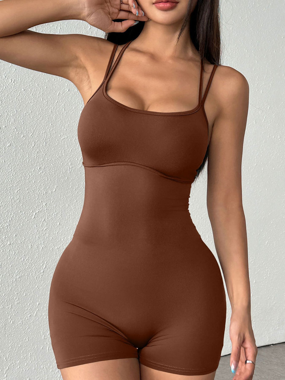 Plush Fashion Hub double spaghetti strap active romper with sleeveless design and fitted silhouette on a white background.