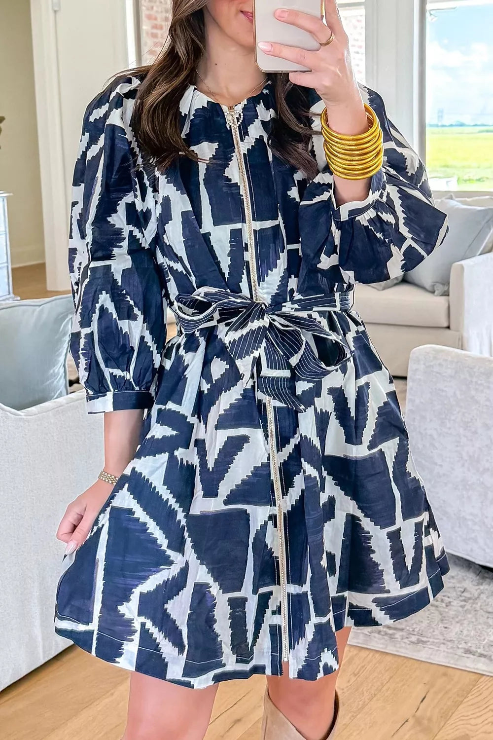 Abstract geometric print Plush Fashion Hub shift dress with zip front and tie waist, featuring a modern, stylish design.