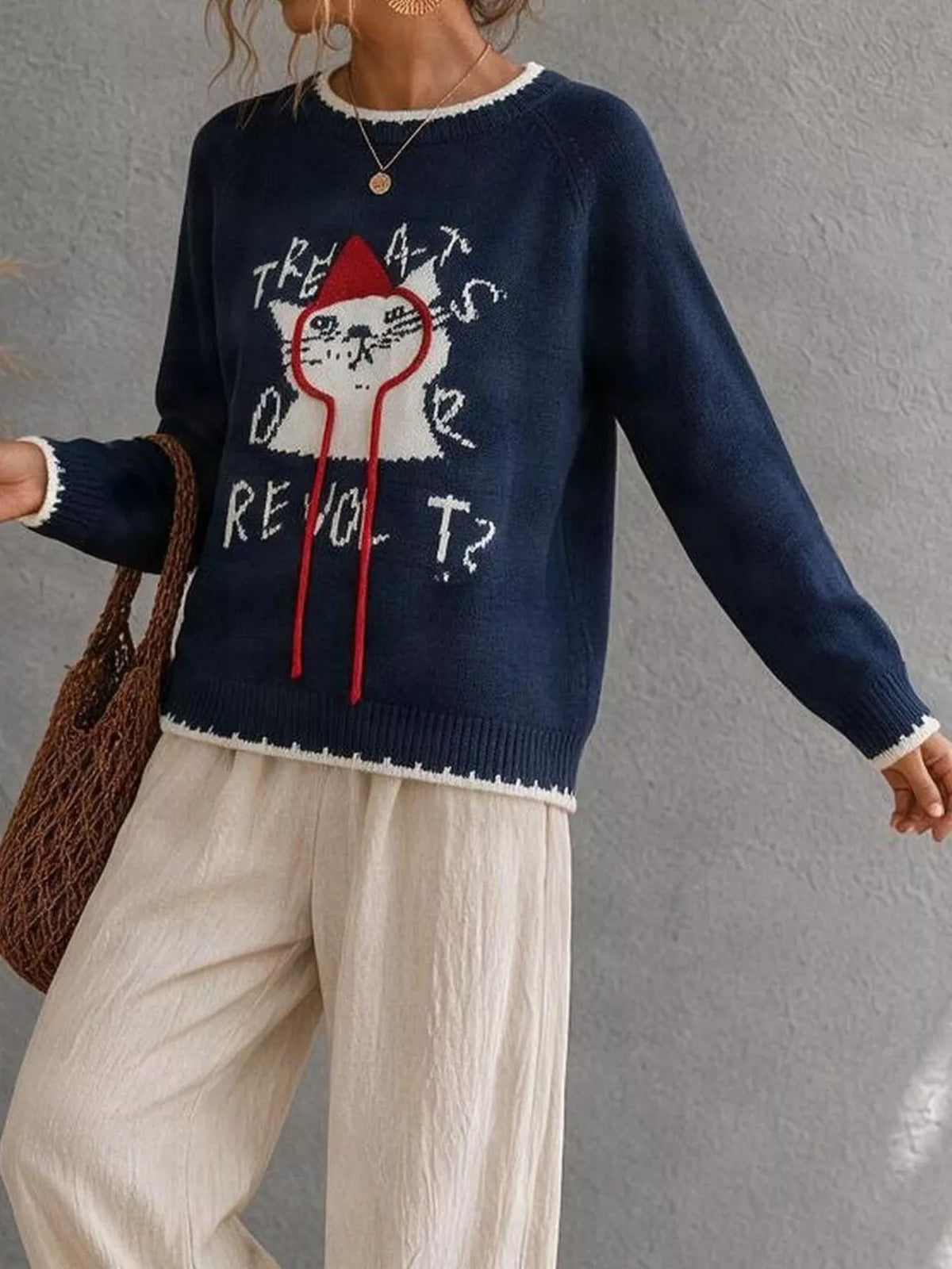Cat raglan sleeve sweater by Trendsi featuring a cozy knit design and stylish fit, perfect for casual wear.