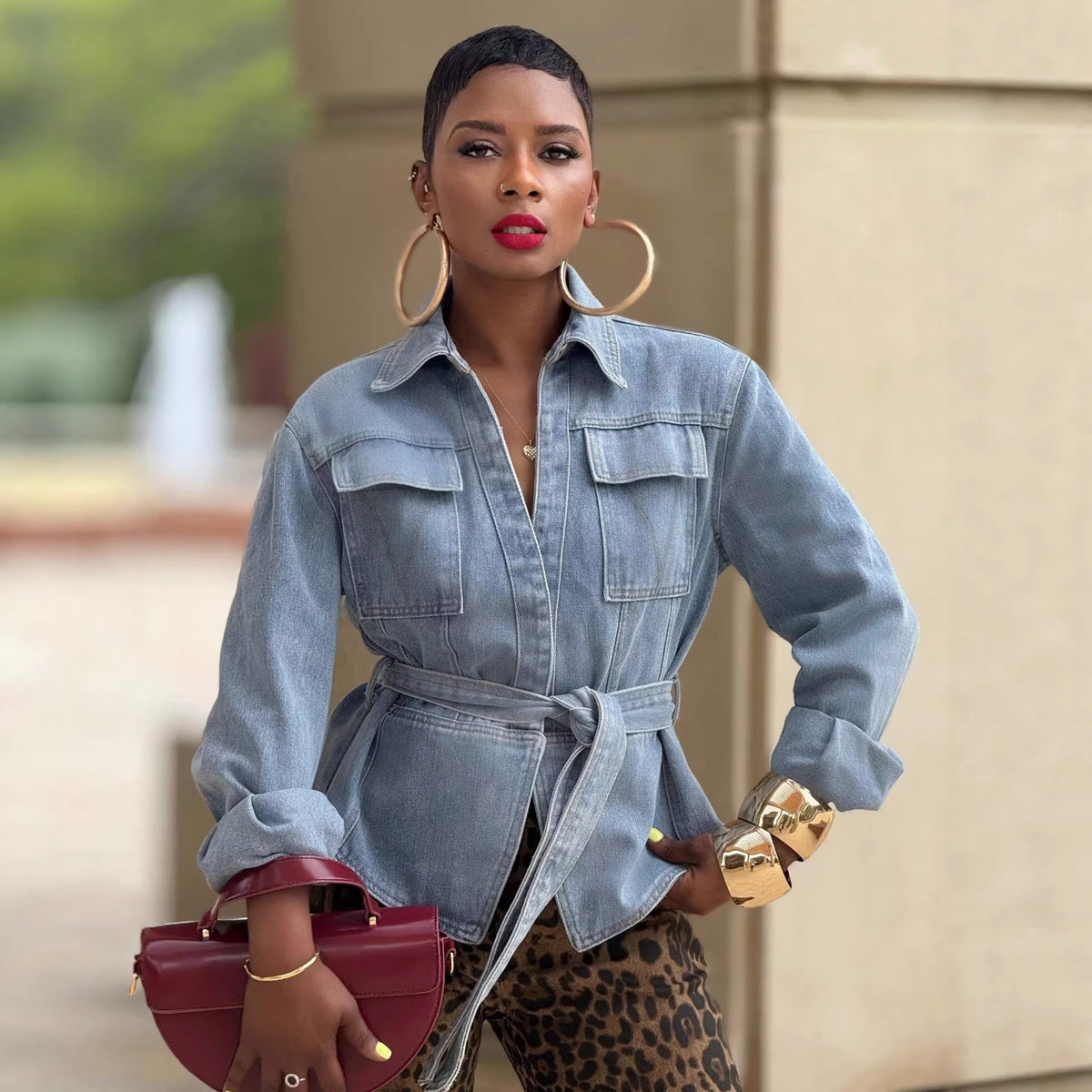 Casual washed denim jacket with pockets and belt, eprolo brand, featuring a relaxed fit and stylish design.