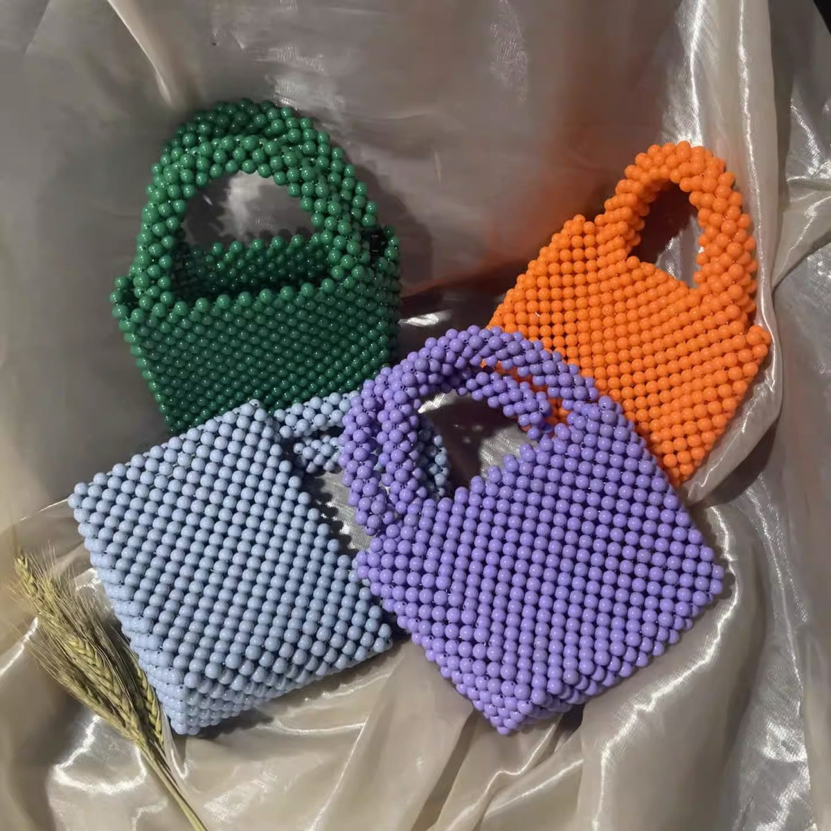 Eprolo beaded handbag with solid color design, featuring intricate beaded patterns and a stylish handheld bag for fashion.