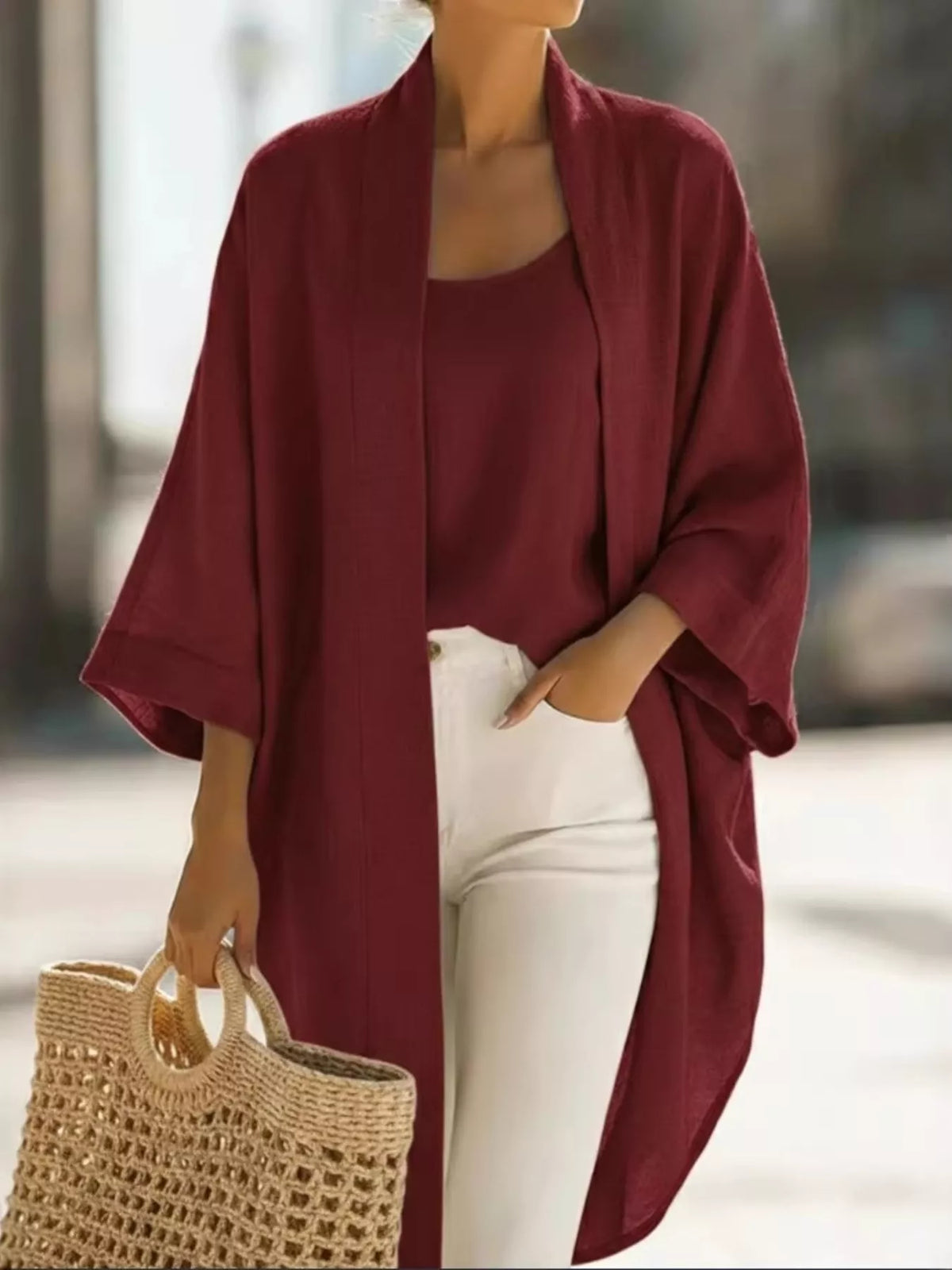 Plus size open-front cardigan and matching tank top set by Trendsi, featuring a soft, comfortable knit fabric in a stylish design.