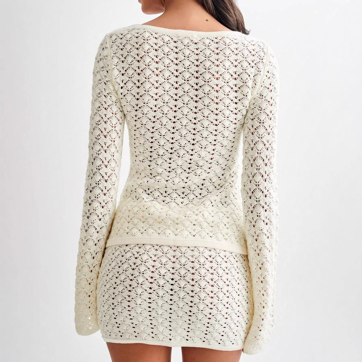 Plush Fashion Hub long sleeve cardigan and A-line skirt two-piece sweater set displayed on a model.